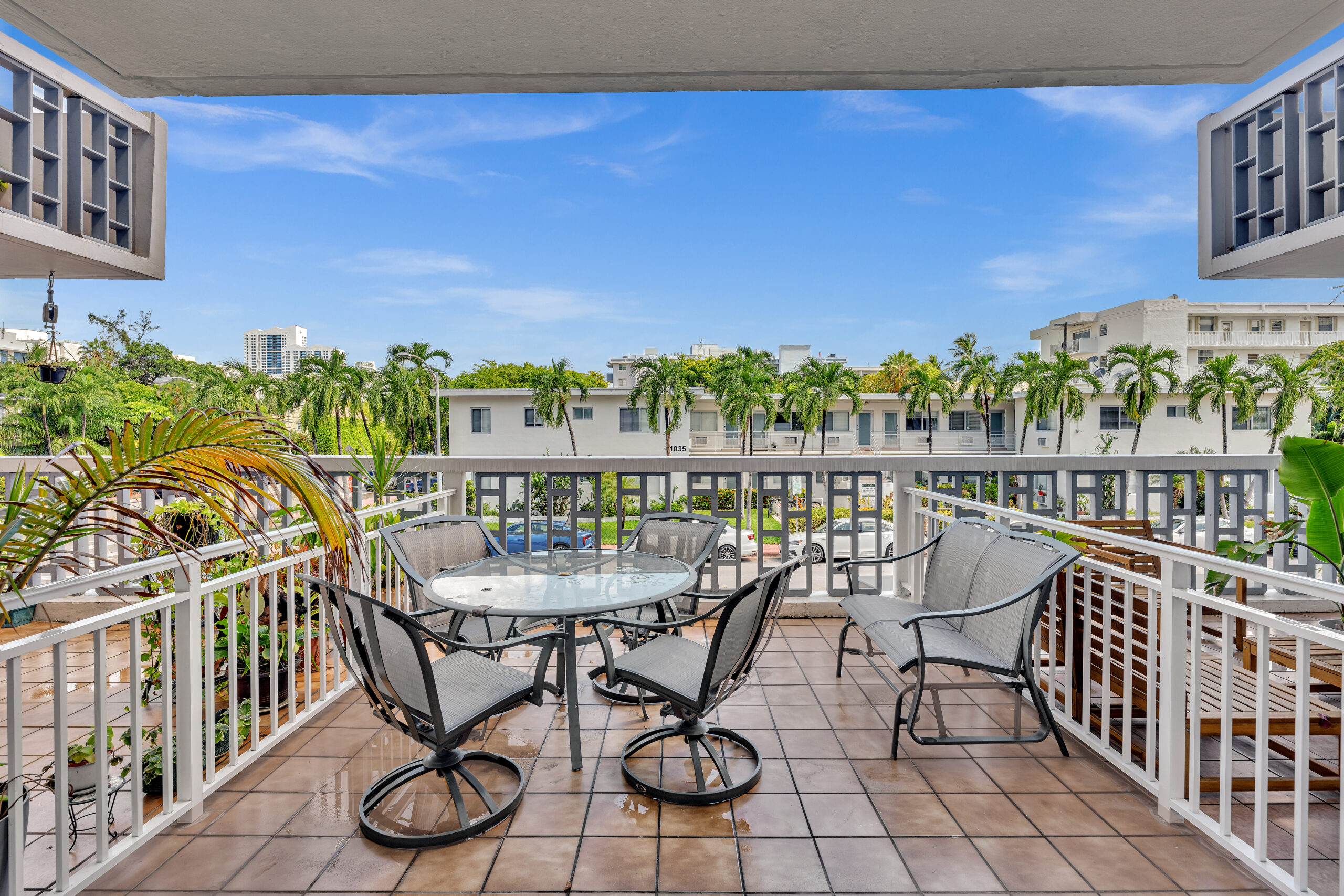 Interior view of Lenox Towers condominium unit looking out toward the balcony and courtyard.